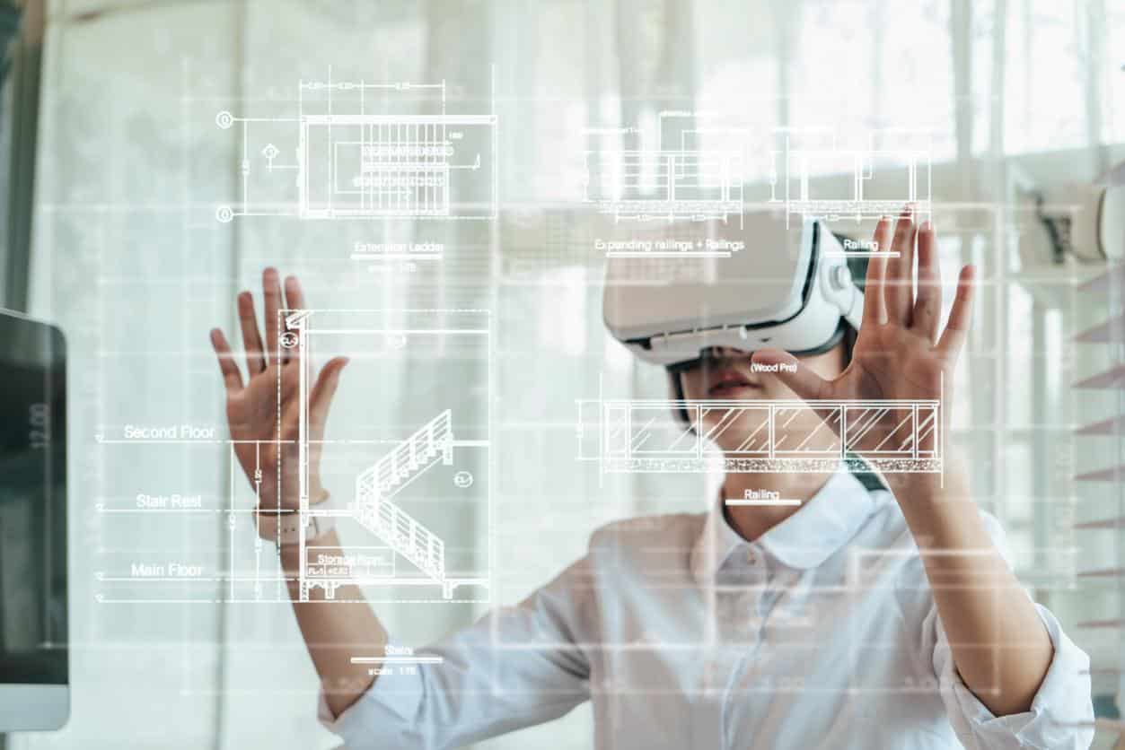 Asian woman Architect or Engineer wearing VR headset for hologram blueprint detail working with BIM technology. Concept futuristic construction design. Selective focus.